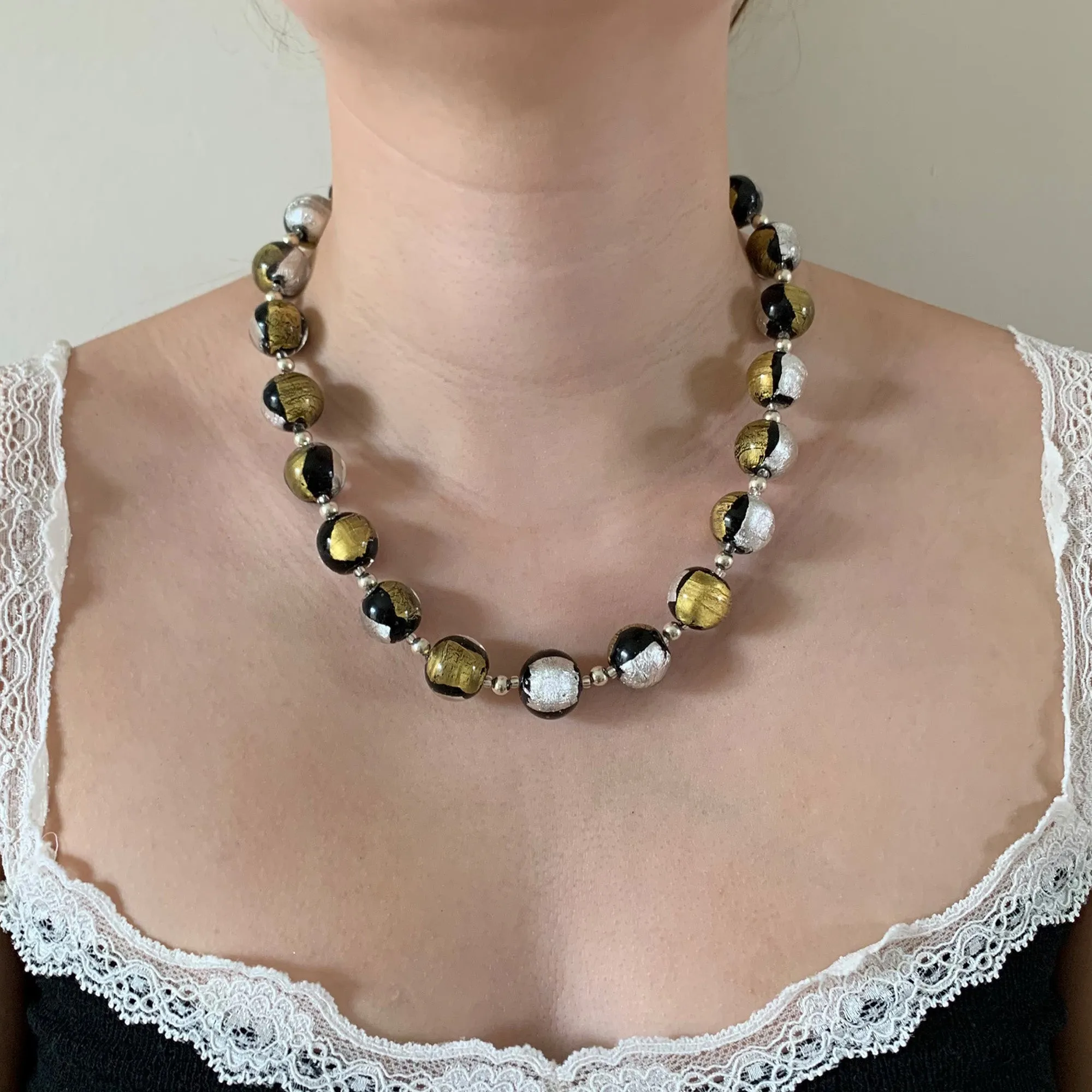 Necklace with black pastel, silver and gold Murano glass sphere beads on silver