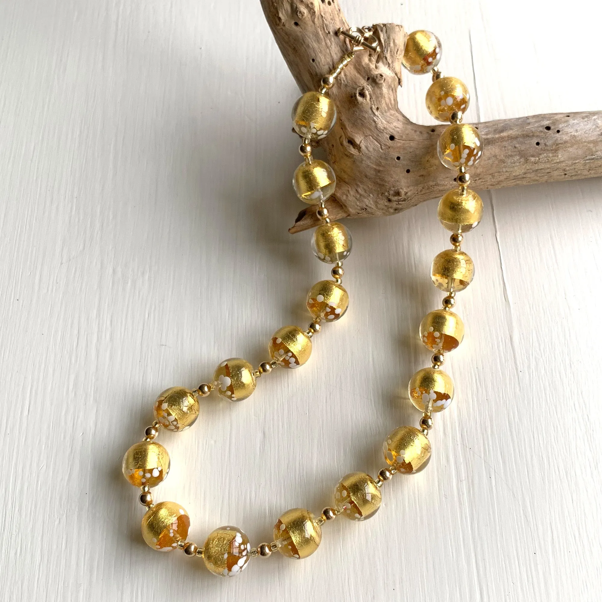 Necklace with clear crystal, gold and white spots Murano glass sphere beads on gold